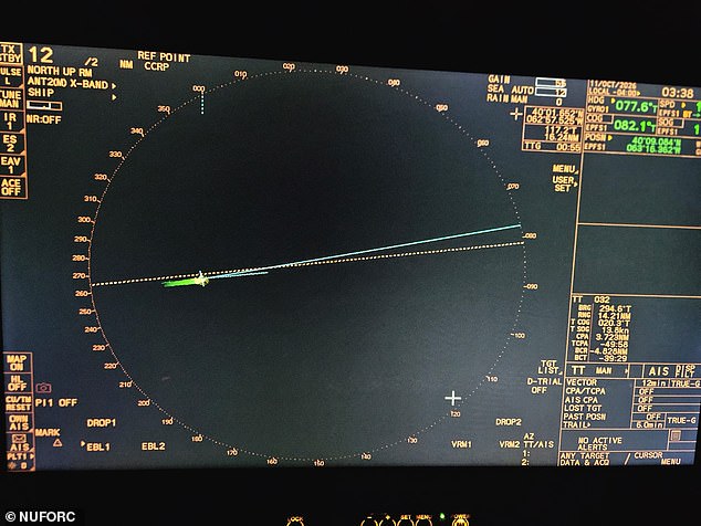 A ship&rsquo;s radar display photographed during the reported encounter: range rings, the ship&rsquo;s own vector line, and no targets. The readout is timestamped 03:38 on 11 October 2026 and carries the NUFORC credit.